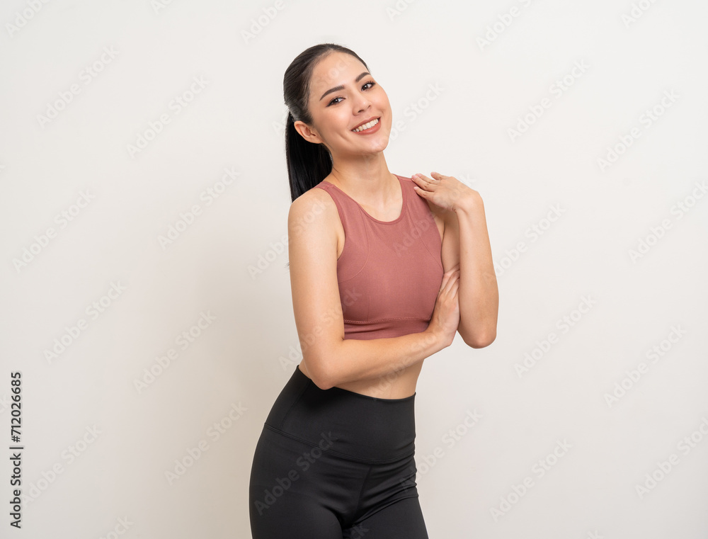 Young beautiful smiling asian woman with sportswear on isolated white background. Portrait happy healthy slim fit and firm latin attractive sporty woman standing pose exercise workout in studio. Young beautiful smiling asian woman with sportswear on isolated white background. Portrait happy healthy slim fit and firm latin attractive sporty woman standing pose exercise workout in studio.