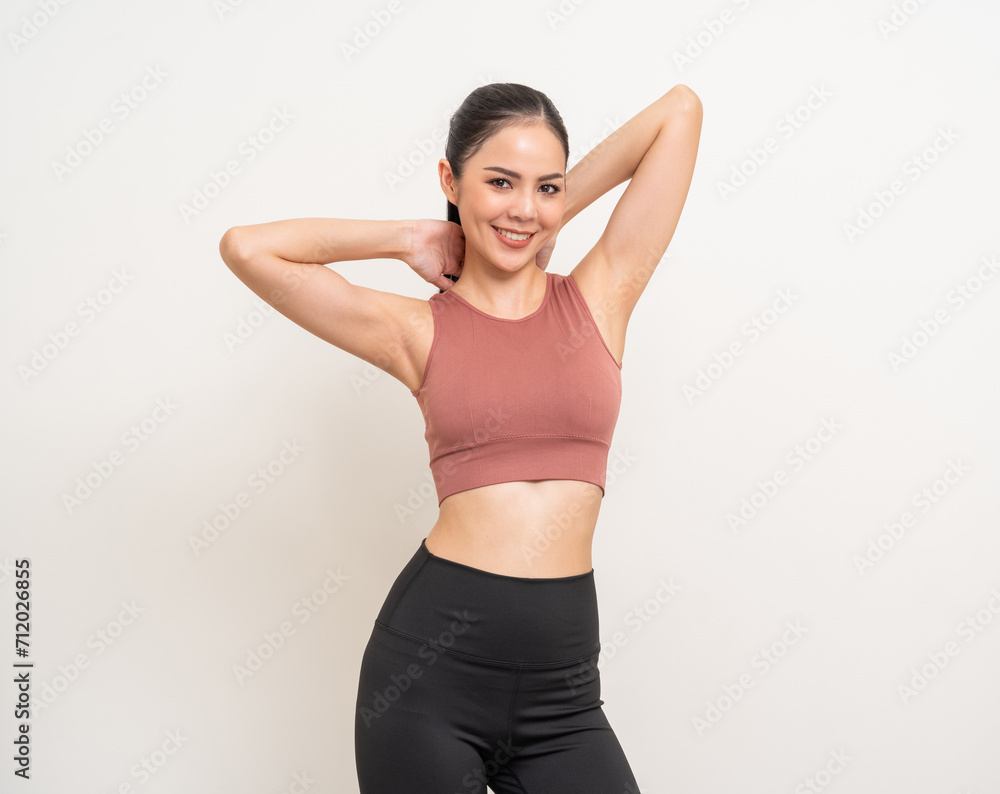 Young beautiful smiling asian woman with sportswear on isolated white background. Portrait happy healthy slim fit and firm latin attractive sporty woman standing pose exercise workout in studio.