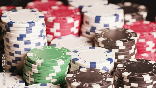Poker chips with playing cards on table photo