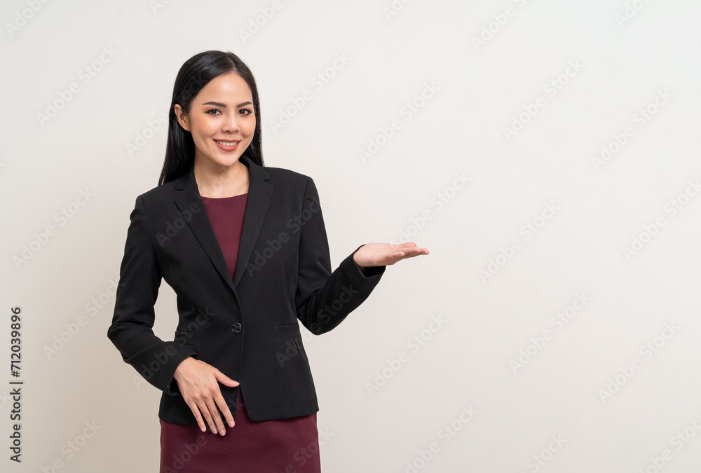 Attractive Young asian business woman smiling to camera standing pose on isolated white background. Latin Female around 25 in black suit portrait shot in studio. Attractive Young asian business woman smiling to camera standing pose on isolated white background. Latin Female around 25 in black suit portrait shot in studio.