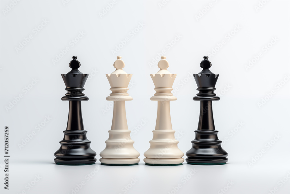 Black and white chess pieces on a white background. The concept of leadership Black and white chess pieces on a white background. The concept of leadership