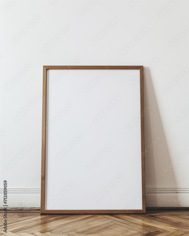 mockup of a blank large light oak frame leaning against a white wall. - obrazy, fototapety, plakaty 