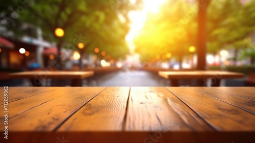 The empty wooden table top with blur background of outdoor cafe in the morning. Exuberant image. generative ai © Summit Art Creations