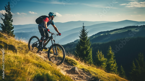 mountain biking woman riding on bike in summer mountain photo