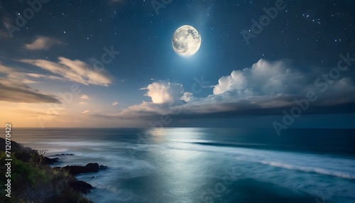 moon over the sea.a breathtaking view of the night sky, where the moon casts a gentle radiance on clouds floating above the vastness of the ocean.