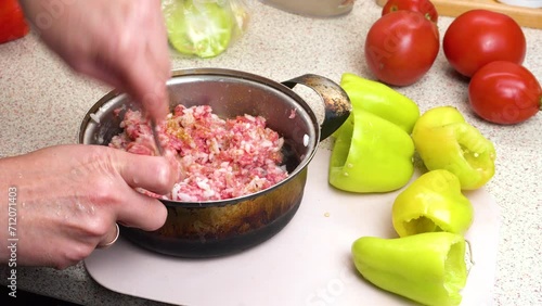 Preparation of minced meat for filling stewed stuffed sweet bell peppers. Pepper the minced meat. Step-by-step cooking video recipe. Culinary master class on home cooking. photo