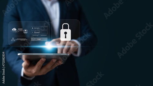 Cybersecurity and data protection, businessman use secure tablet encryption technology, protect business and financial transaction data from cyber attacks, intelligent protection digital attacks.