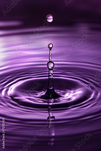 drop of water in purple background 