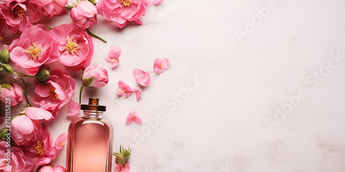 flat lay with a bottle of rose oil and rose flowers. essential oil