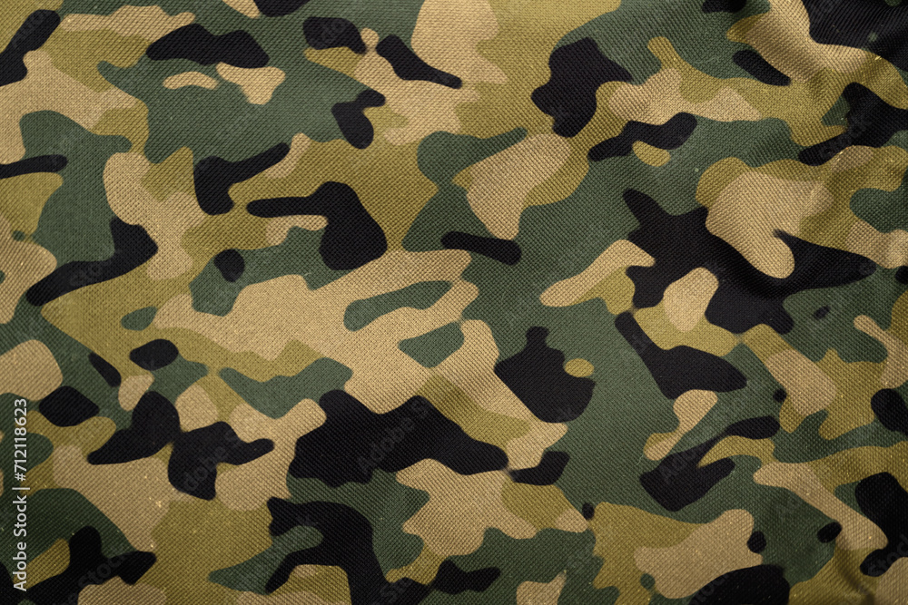 Fototapeta premium green khaki woodland army camouflage tarp texture , camo fabric background