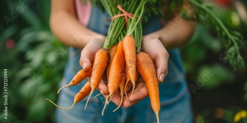 Woman farmer holding carrots