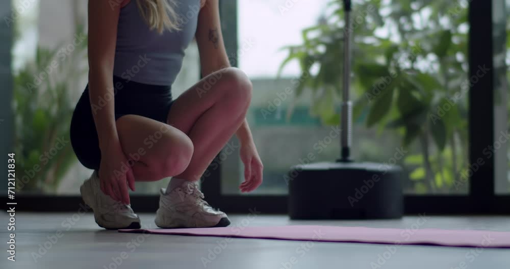 Young beautiful fit sport woman work out by exercise yoga in gim. B roll shot of woman roll out yoga mat for preparation. Close up view on hand when open mat. 4K Young beautiful fit sport woman work out by exercise yoga in gim. B roll shot of woman roll out yoga mat for preparation. Close up view on hand when open mat. 4K