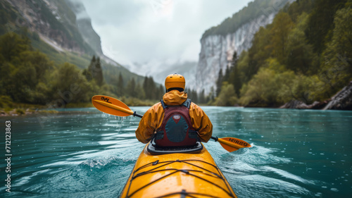 kayaker with whitewater kayaking, down a white water rapid river in the mountains, beautiful landscape background,henerative ai © JKLoma