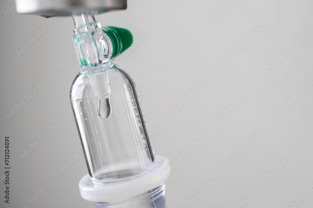 Close up medical intravenous IV drip in hospital background Close up medical intravenous IV drip in hospital background