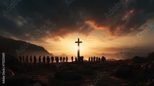 silhouette of people standing with cross on rocks.