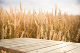 Wooden Plank Empty Table For Products Display With Blurred Wheat Field and Blue Sky Background. High quality photo