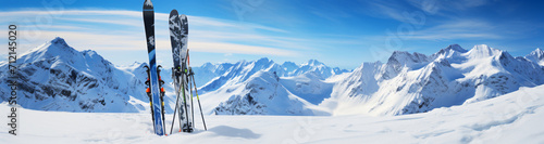 skis and ski poles in the park on a hill with clear blue sky, in the style of lens flare, whistlerian, photo taken with provia, shaped canvas, wimmelbilder, bold landscapes, landscape