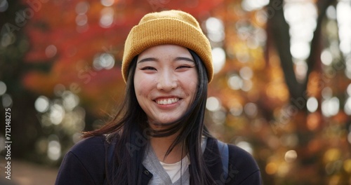 Woman, forest and portrait in Kyoto, garden and tourist with happiness, traditional history and travel. Nature, japanese culture and explore in woods with trees, adventure and holiday walk in autumn © CineLens/peopleimages.com