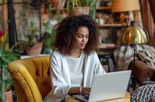 a woman working in her office with a laptop