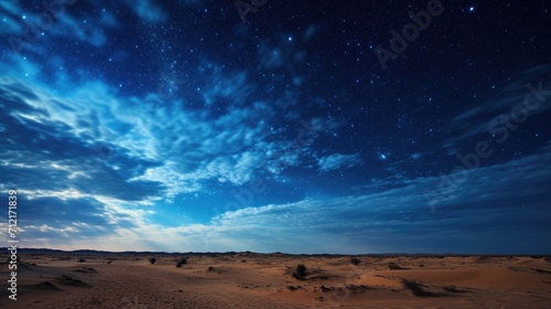 Scenic view of a sandy desert under the starry night sky