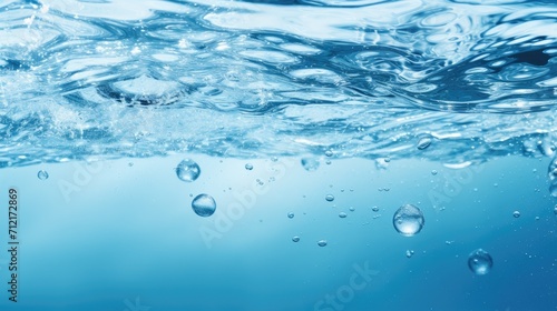 Air bubbles rising below the water surface