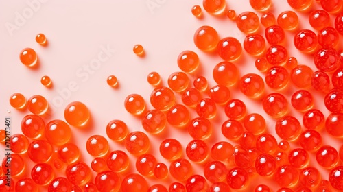 Red Caviar Beads Scattered on Pastel Pink