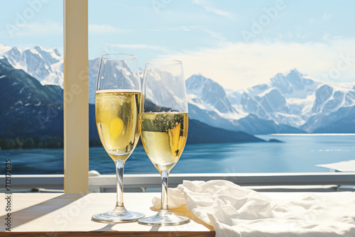 a glass of champagne in front of snowy mountains, in the style of photorealist details, light yellow and white, poster, photo taken with provia,