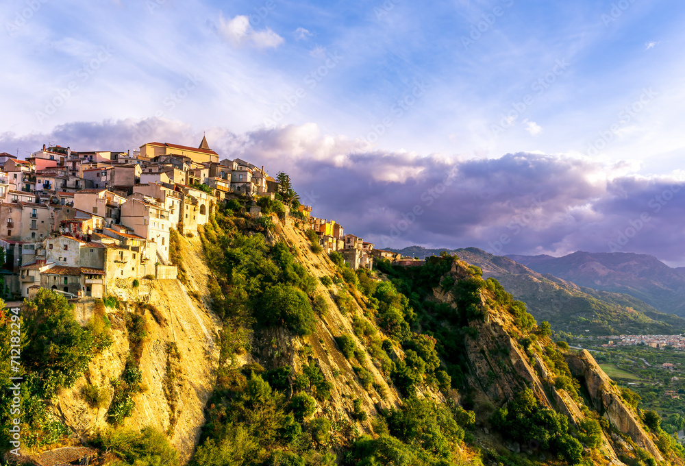 brautiful landscape of old mountain town on a rock in vintage mediterranean style with green mountains and highlands on backgeound