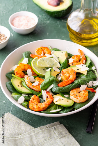 Salad with shrimps, avocado, spinach and almonds. Healthy eating. Diet.