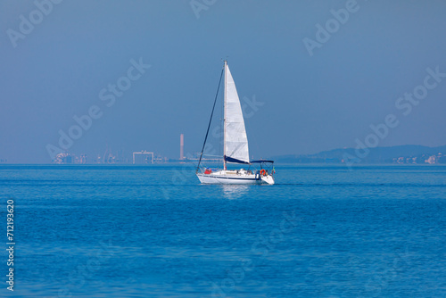Sailing yacht in the Mediterranean sea on a background of blue sky . White yacht at blue sea
