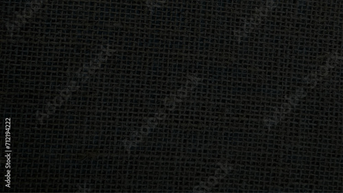 Jute hessian sackcloth canvas woven texture pattern background in light black color blank empty. Black Hemp rope texture background. Haircloth wale black dark cloth wallpaper. 