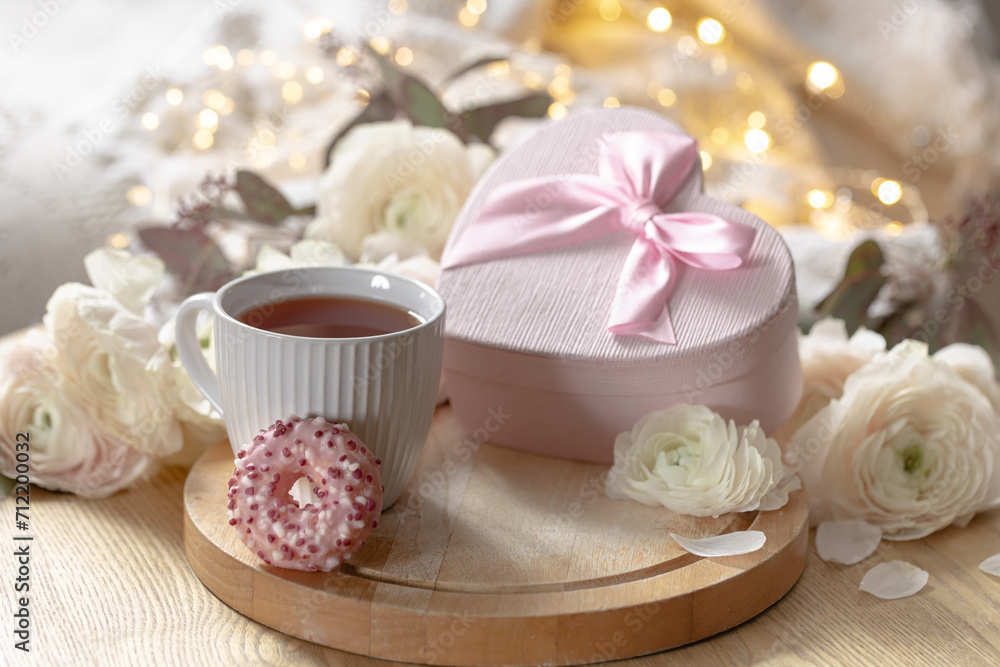 Romantic composition with a cup of tea, gift box and flowers. Romantic composition with a cup of tea, gift box and flowers.