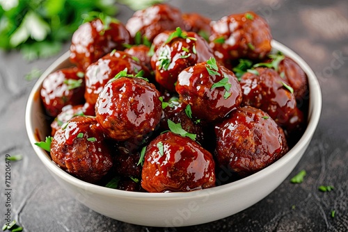 Crockpot meatballs in homemade barbecue sauce served in a bowl photo