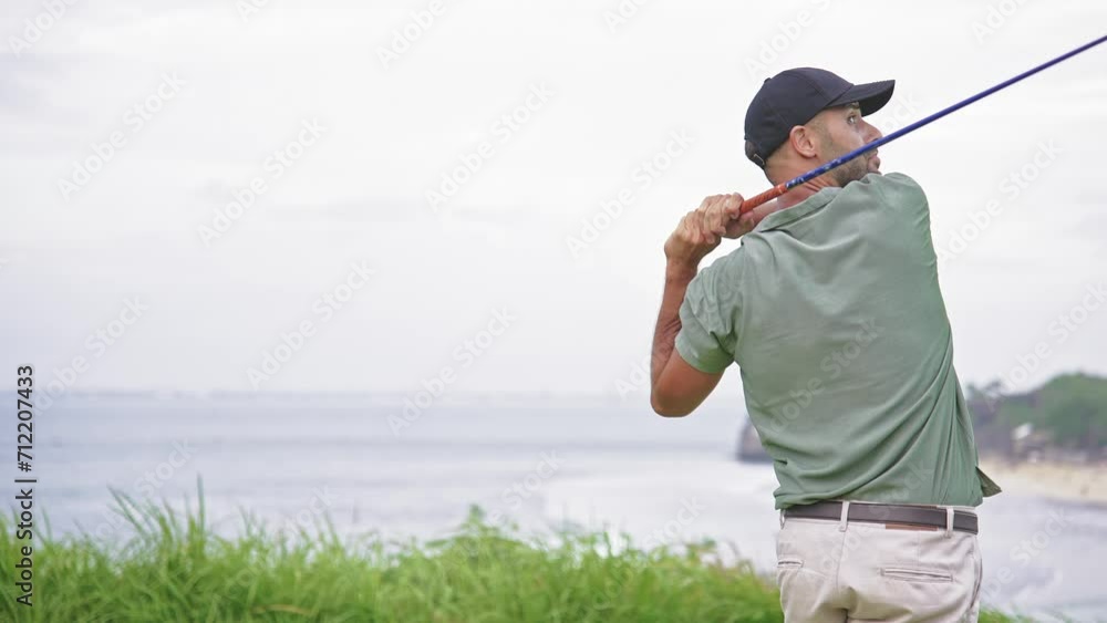 Sports Man on Golf Course Playing Game Hits Ball by Club and Misses. Active Morning of Rich Athletic Male in Recreational Area of Tropical Paradise. Modern Concept of Challenge for Professional Person Sports Man on Golf Course Playing Game Hits Ball by Club and Misses. Active Morning of Rich Athletic Male in Recreational Area of Tropical Paradise. Modern Concept of Challenge for Professional Person