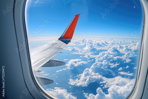 Observing the sky and clouds from an airplane s window focusing on the wing