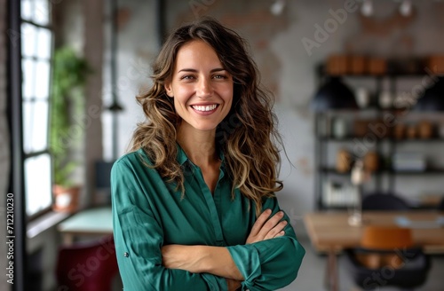 woman smiling with arms folded at a office
