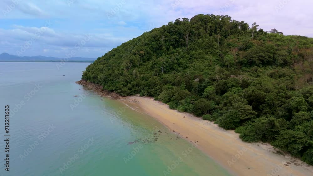 calm beach with crystal clear water at Koh Libong Island Trang province Thailand Andaman Sea. Tropical Island with palm trees and emerald green ocean with longtail boats calm beach with crystal clear water at Koh Libong Island Trang province Thailand Andaman Sea. Tropical Island with palm trees and emerald green ocean with longtail boats