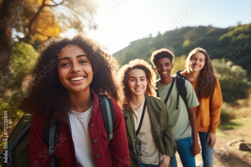 Multiethnic group of teenage friends hiking in nature