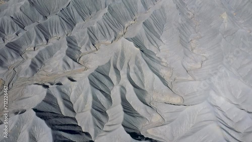 Wallpaper Mural Mudstone formations of steel blue wavy sharp rocks ridges western Usa. Factory Butte canyon towering of wonder foothills. Aerial view over rugged terrain structure carved riverbed by erosion Torontodigital.ca
