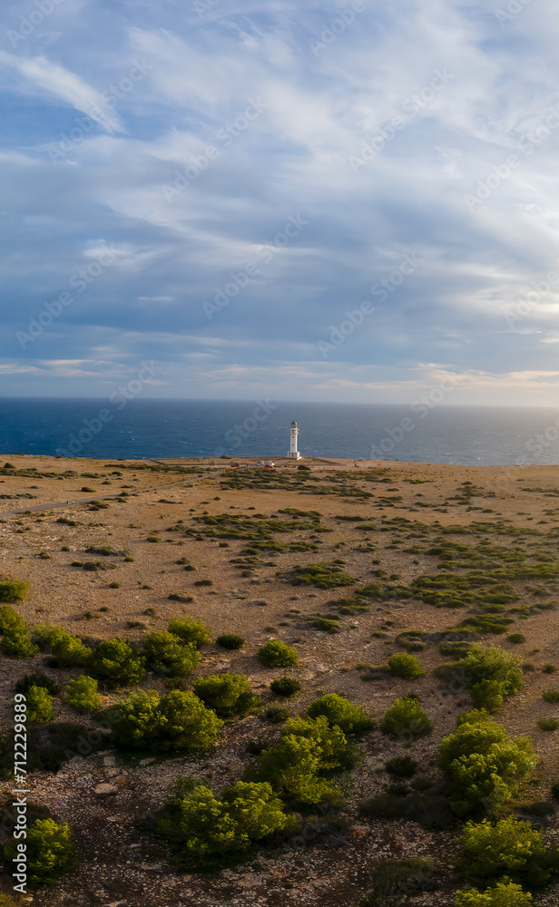 Remote Lighthouse Overlooking the Sea at Sunset