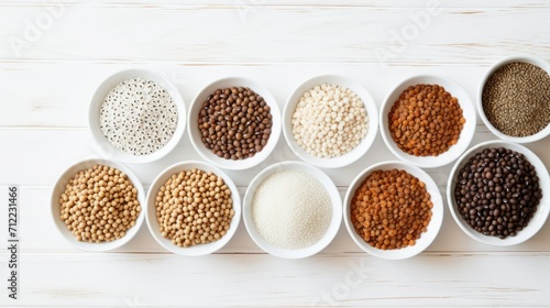 Top view of a variety of cereals, grains, wheat ears, legumes on a white isolated background. Agricultural products concepts.
