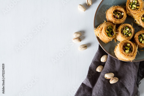 Traditional arabic dessert baklava with pistachios. White background photo