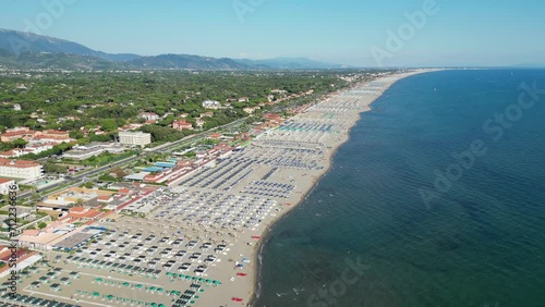 Beach and Coastline of Forte dei Marmi at Summer Vacation in Tuscany, Italy - Aerial 4k photo