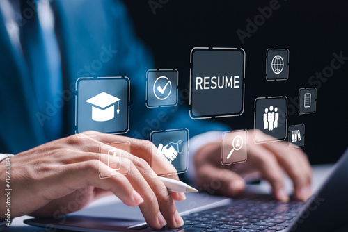 HR manager use laptop to checking resume for employee recruitment. Human resource management (HR), Screening employee information and job applicants. photo