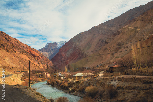 the river flow in a town city with a bridge connecting each other town in Tajikistan