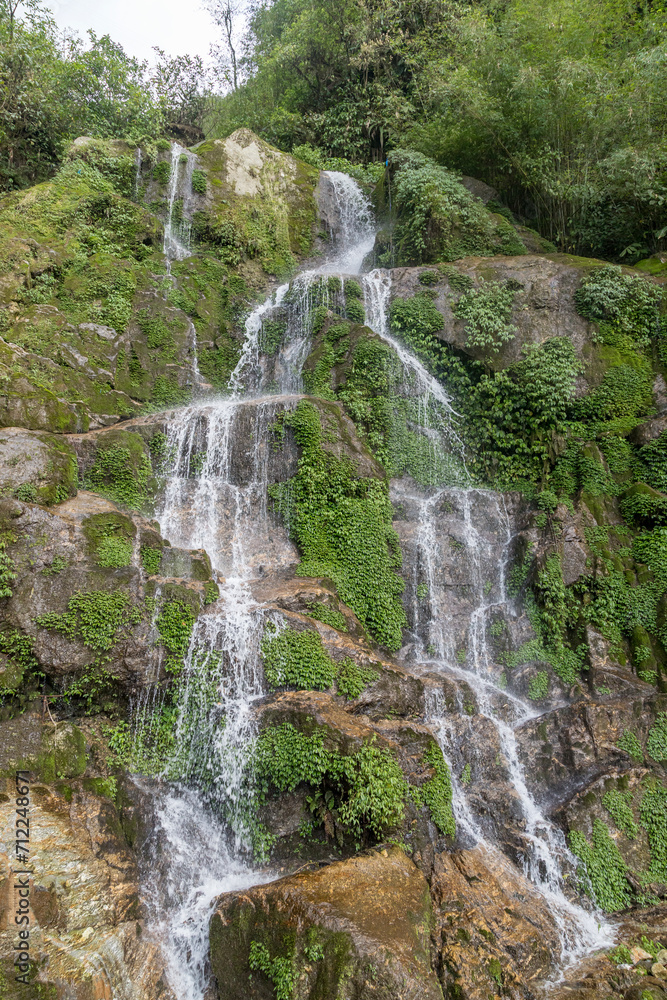 Beautiful cascading Bakthang waterfall in the Himalayan valley in Sikkim, India