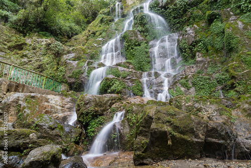 Fototapeta Naklejka Na Ścianę i Meble -  Beautiful cascading Bakthang waterfall in the Himalayan valley in Sikkim, India