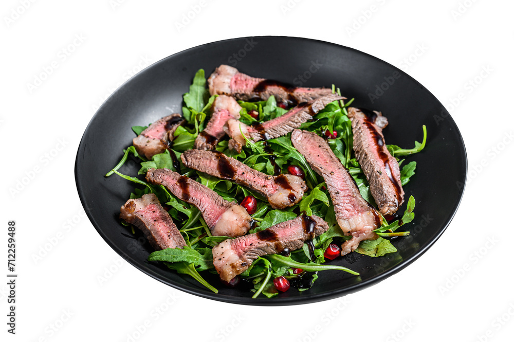 Sliced grilled beef steak with arugula leaves salad.  Transparent background. Isolated.