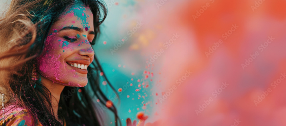 A woman immersed in the spirit of Holi, her face adorned with vibrant colors, celebrating the festival's joy and cultural richness