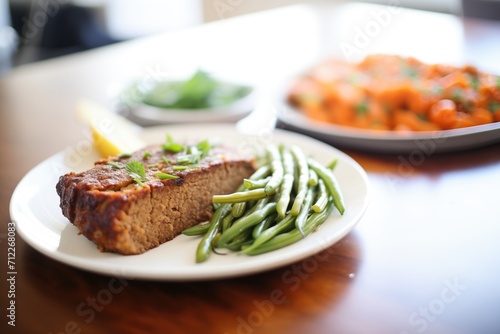 meatloaf with a side of green beans and carrots